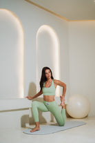 women wearing gym leggings yoga pose